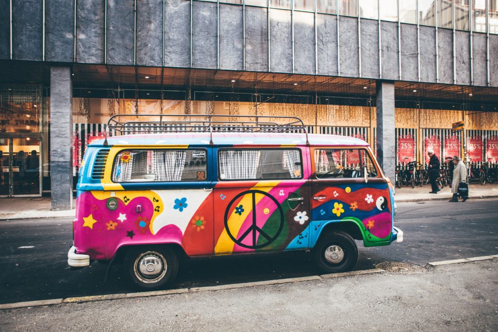 Multicoloured, rainbows and flowers VW campervan. To represent that things are never black and white!